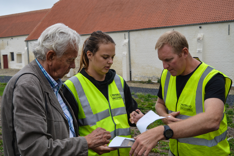 Rob, Charlotte and Charlie going over the excavation data