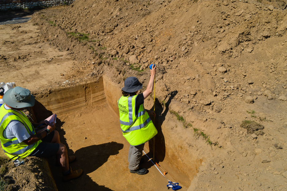 Camille measuring the height of the trench
