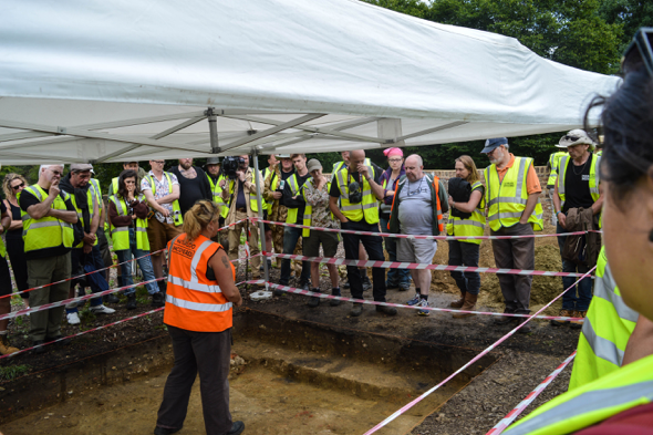 The group gathered around Emily’s trench.