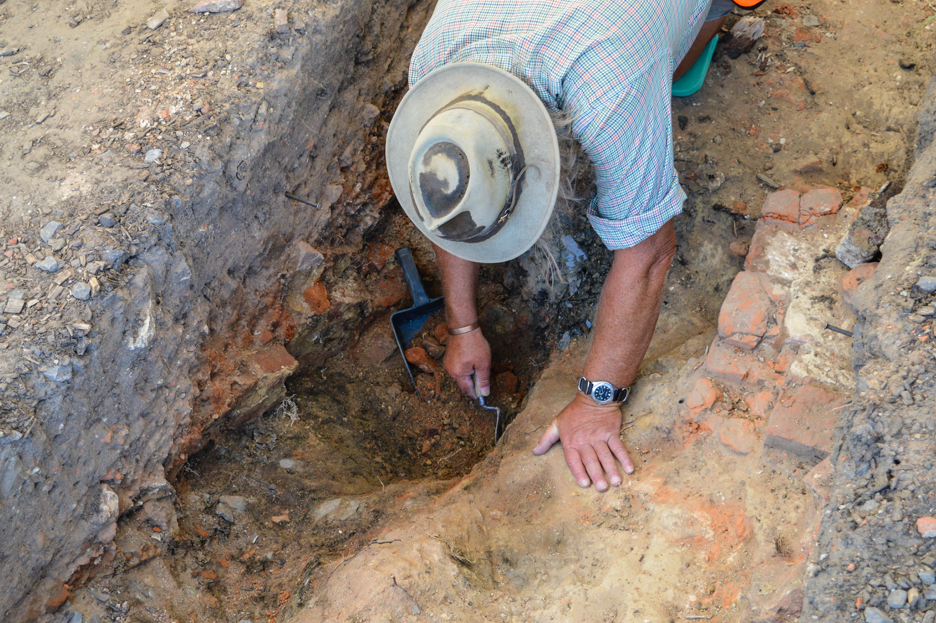 Phil revealing another layer of brick